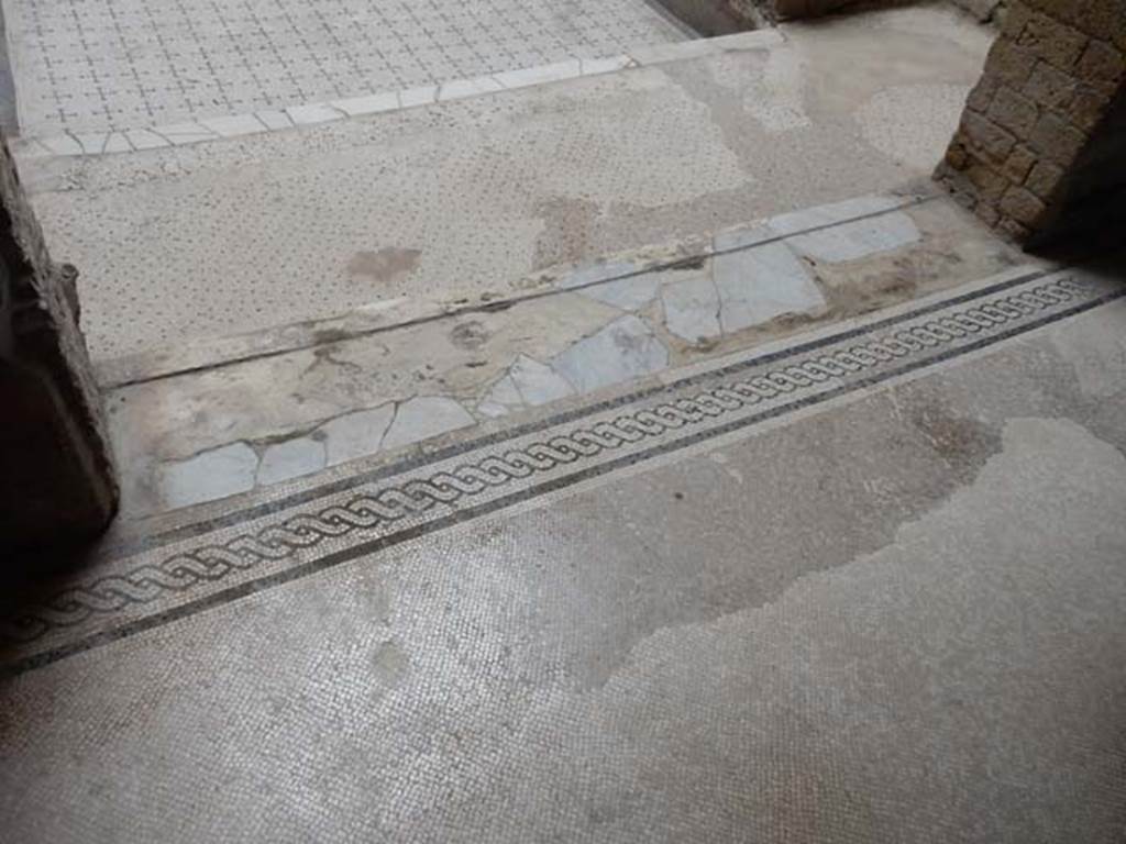 V.8 Herculaneum. May 2018. Room 7, threshold of doorway, looking north towards stairs in area 4.
Photo courtesy of Buzz Ferebee.